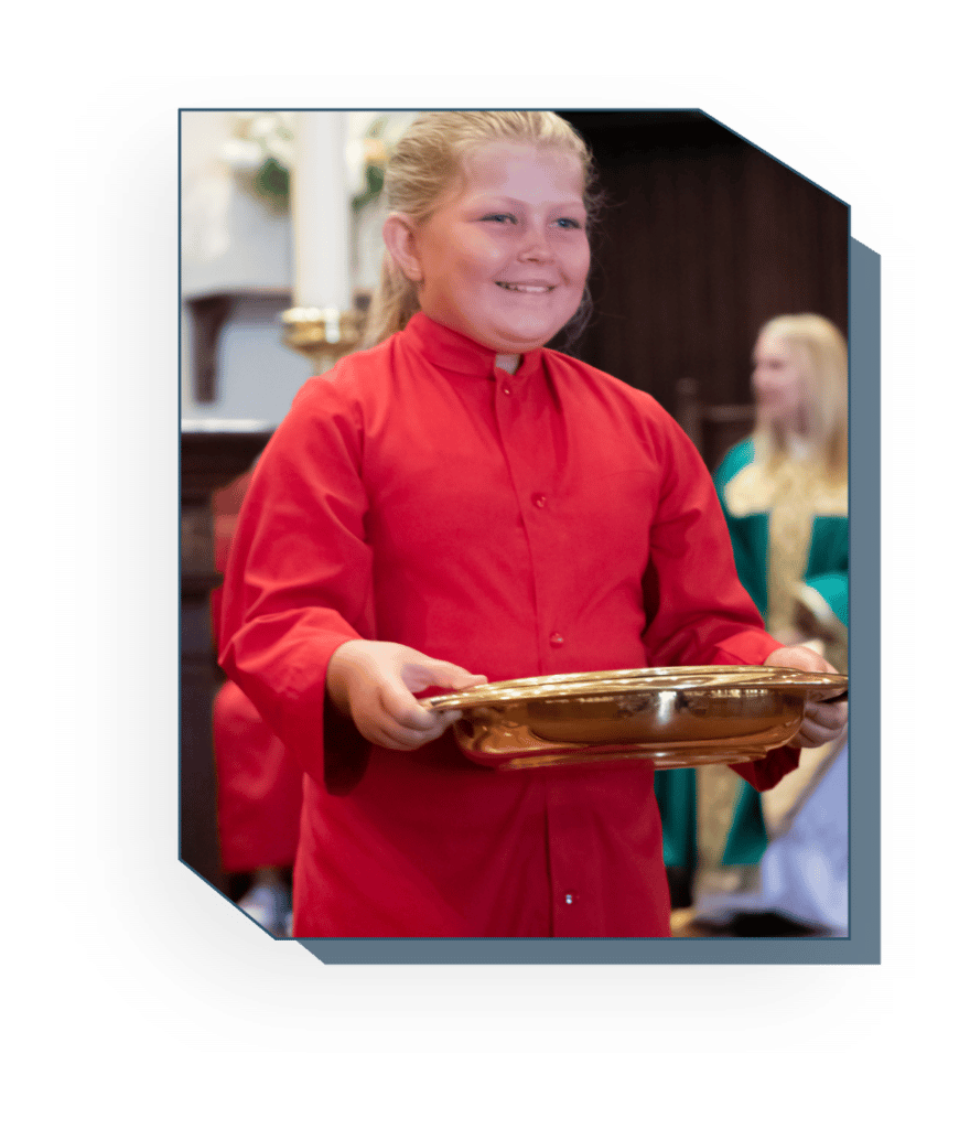 Acolyte holding collection plate at the offertory